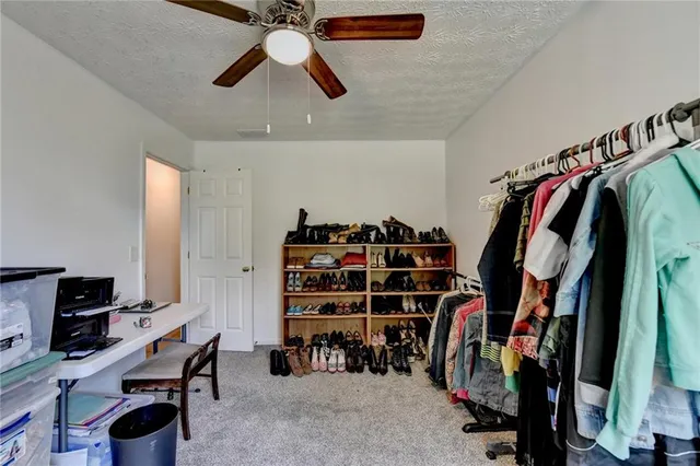 a view of a closet with storage and utility