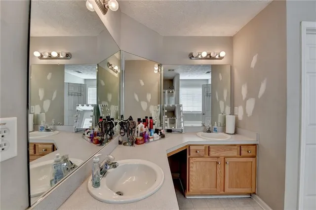 a bathroom with a sink a vanity and a mirror