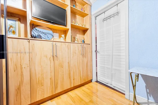 a living room with furniture and flowers