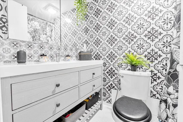 a bathroom with a bathtub and shower curtain