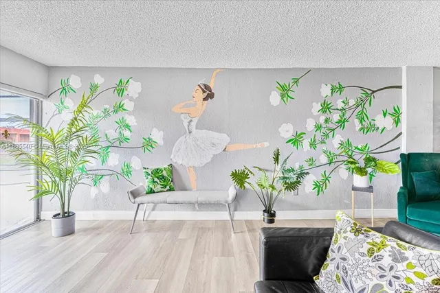 a bedroom that has a bed and a table in it