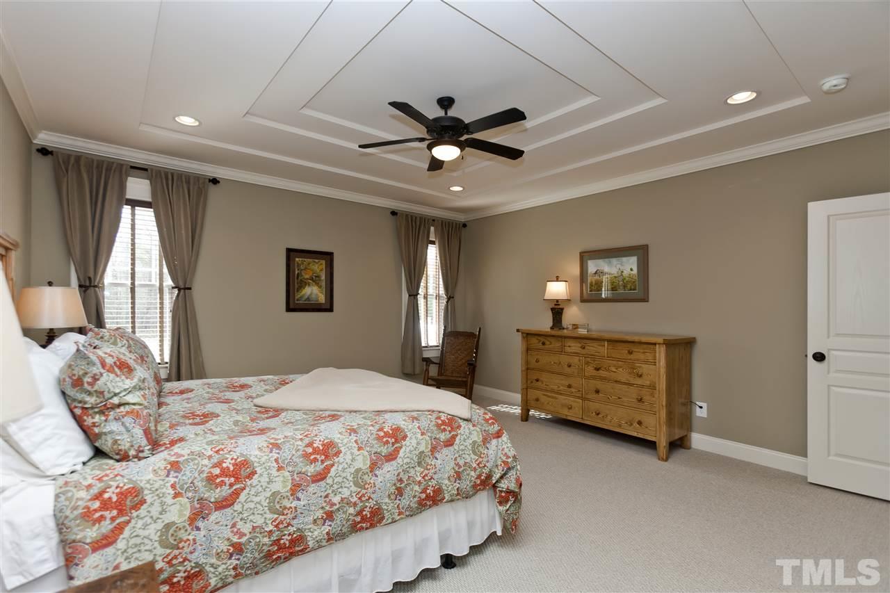 101 South Sunset Ridge Drive Willow Spring, NC 27592 - Photo 13 of 25 a bedroom with a bed and a dresser
