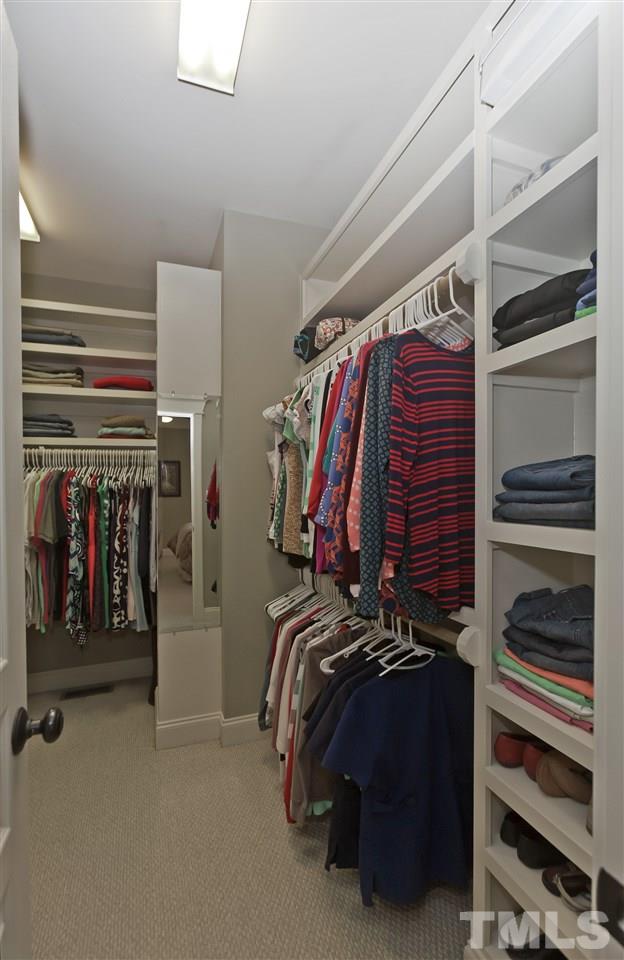 101 South Sunset Ridge Drive Willow Spring, NC 27592 - Photo 14 of 25 a view of walk in closet with clothes and shoes