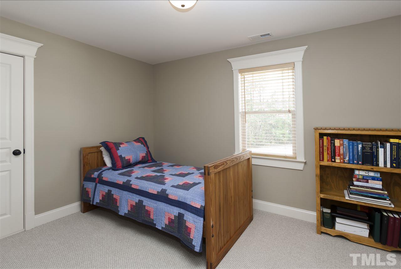 101 South Sunset Ridge Drive Willow Spring, NC 27592 - Photo 17 of 25 a bedroom with a bed and a window