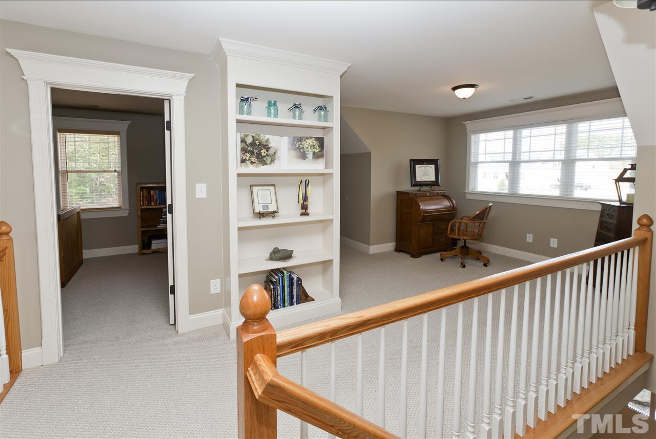 101 South Sunset Ridge Drive Willow Spring, NC 27592 - Photo 21 of 25 a view of a hallway with workspace and a window