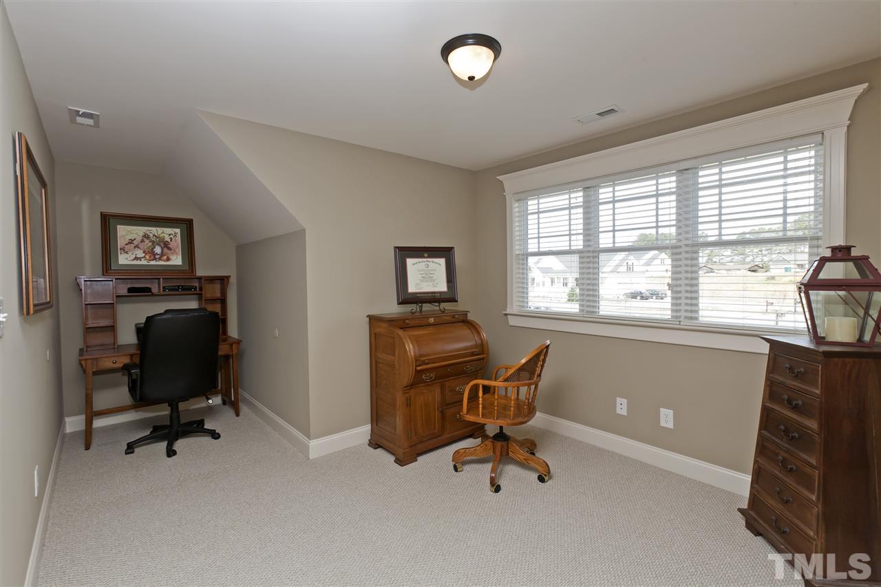 101 South Sunset Ridge Drive Willow Spring, NC 27592 - Photo 22 of 25 a view of a workspace with furniture and a window