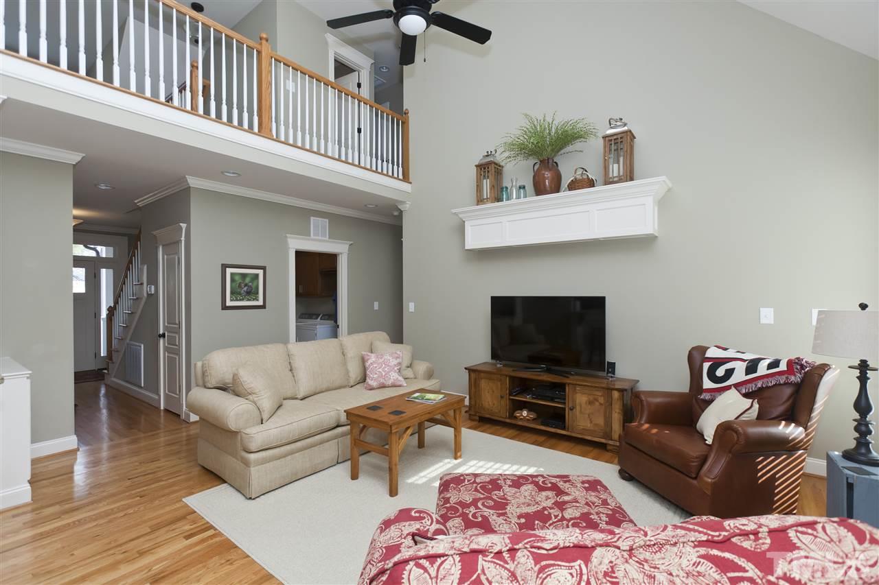 101 South Sunset Ridge Drive Willow Spring, NC 27592 - Photo 4 of 25 a living room with furniture and a flat screen tv
