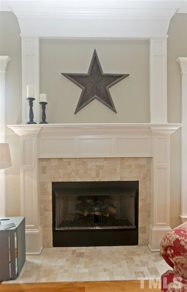 101 South Sunset Ridge Drive Willow Spring, NC 27592 - Photo 5 of 25 a living room with a fireplace and a fireplace