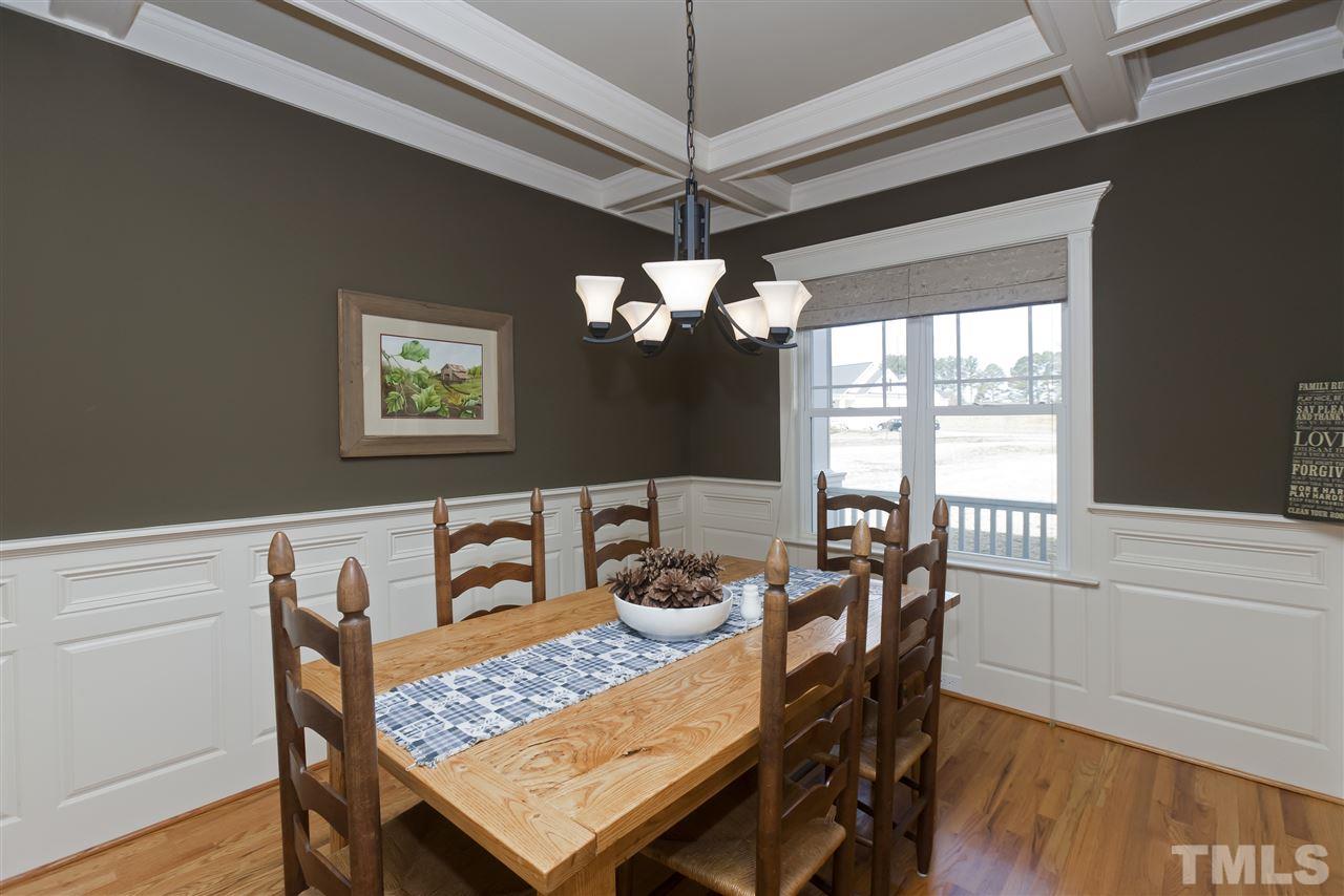 101 South Sunset Ridge Drive Willow Spring, NC 27592 - Photo 6 of 25 a view of a dining room with furniture window and wooden floor