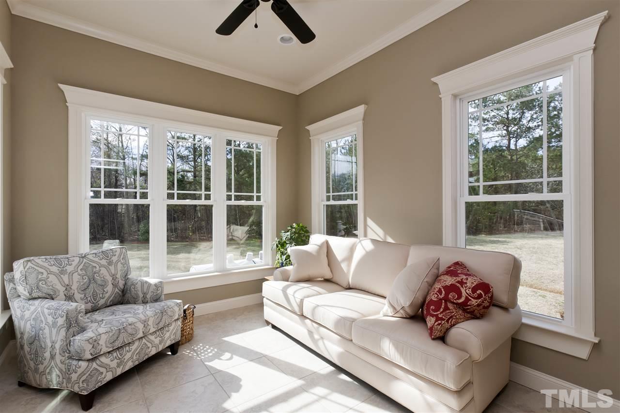 101 South Sunset Ridge Drive Willow Spring, NC 27592 - Photo 10 of 25 a living room with furniture and a large window