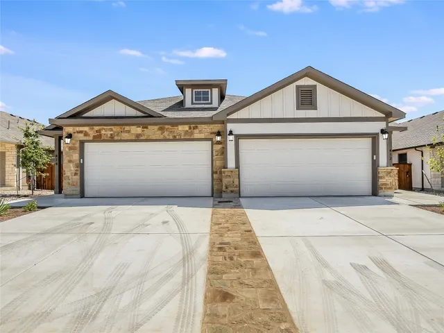 a view of a street with garage