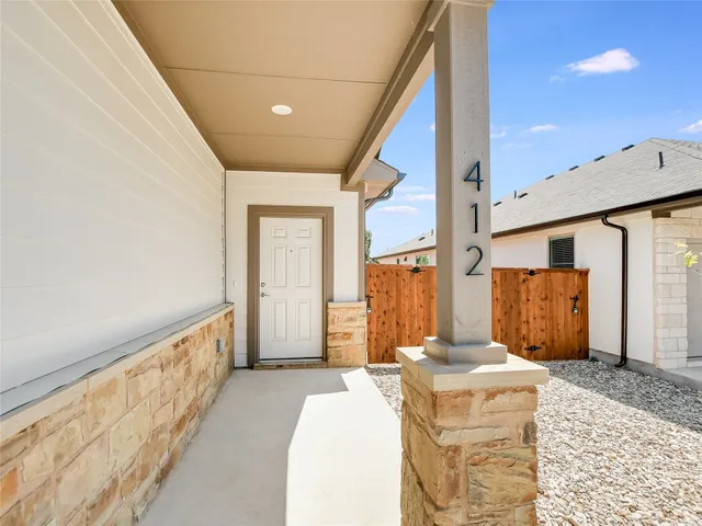 a bathroom with a granite countertop sink and a large mirror