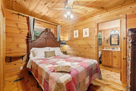 a bedroom with a bed and a mirror