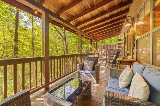 a view of living room with furniture and floor to ceiling windows