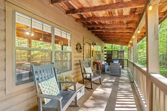 a view of a dining room with furniture wooden floor and outside view