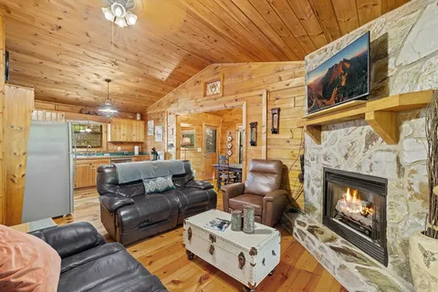 a living room with furniture fireplace and a flat screen tv