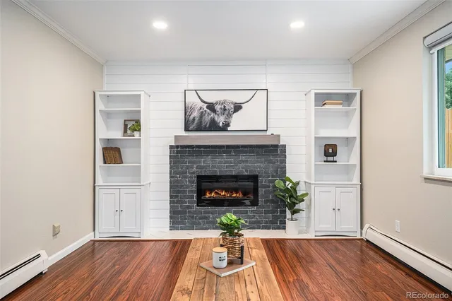a living room with furniture and a fireplace
