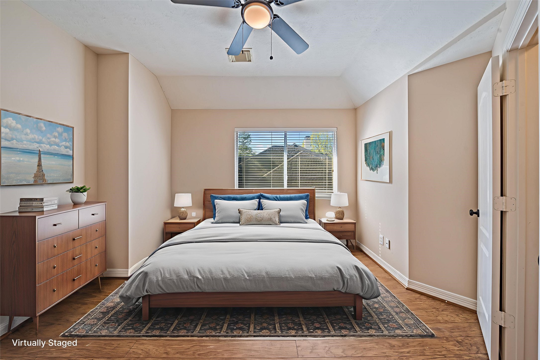 9306 Lochflora Drive Spring, TX 77379 - Photo 32 of 48 a bedroom with a large bed and a chandelier