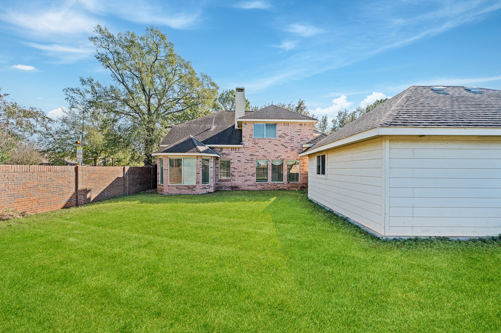 9306 Lochflora Drive Spring, TX 77379 - Photo 39 of 48 a view of a house with a backyard