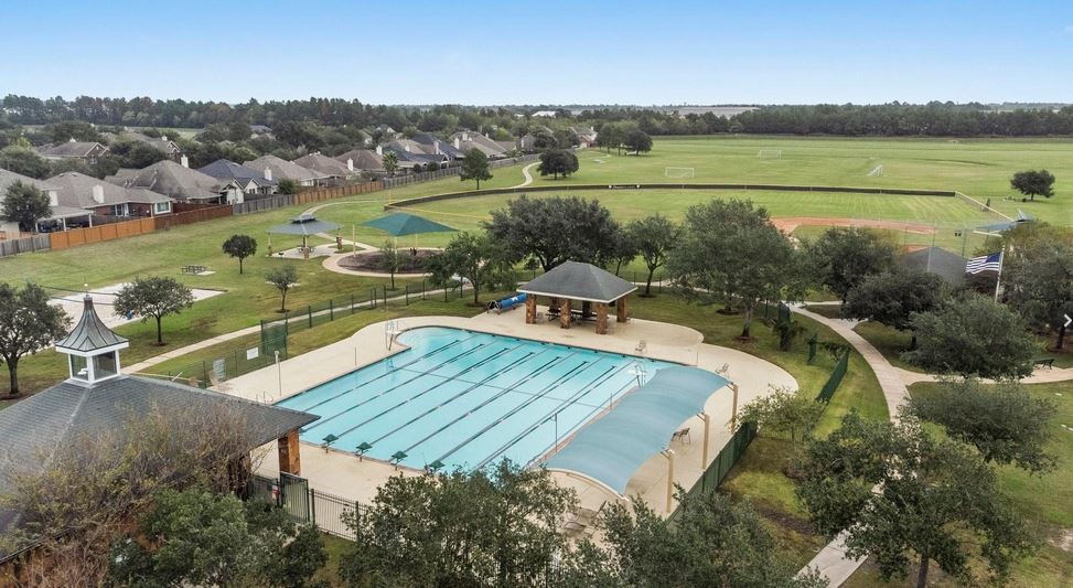 9306 Lochflora Drive Spring, TX 77379 - Photo 44 of 48 an aerial view of a house with a lake view