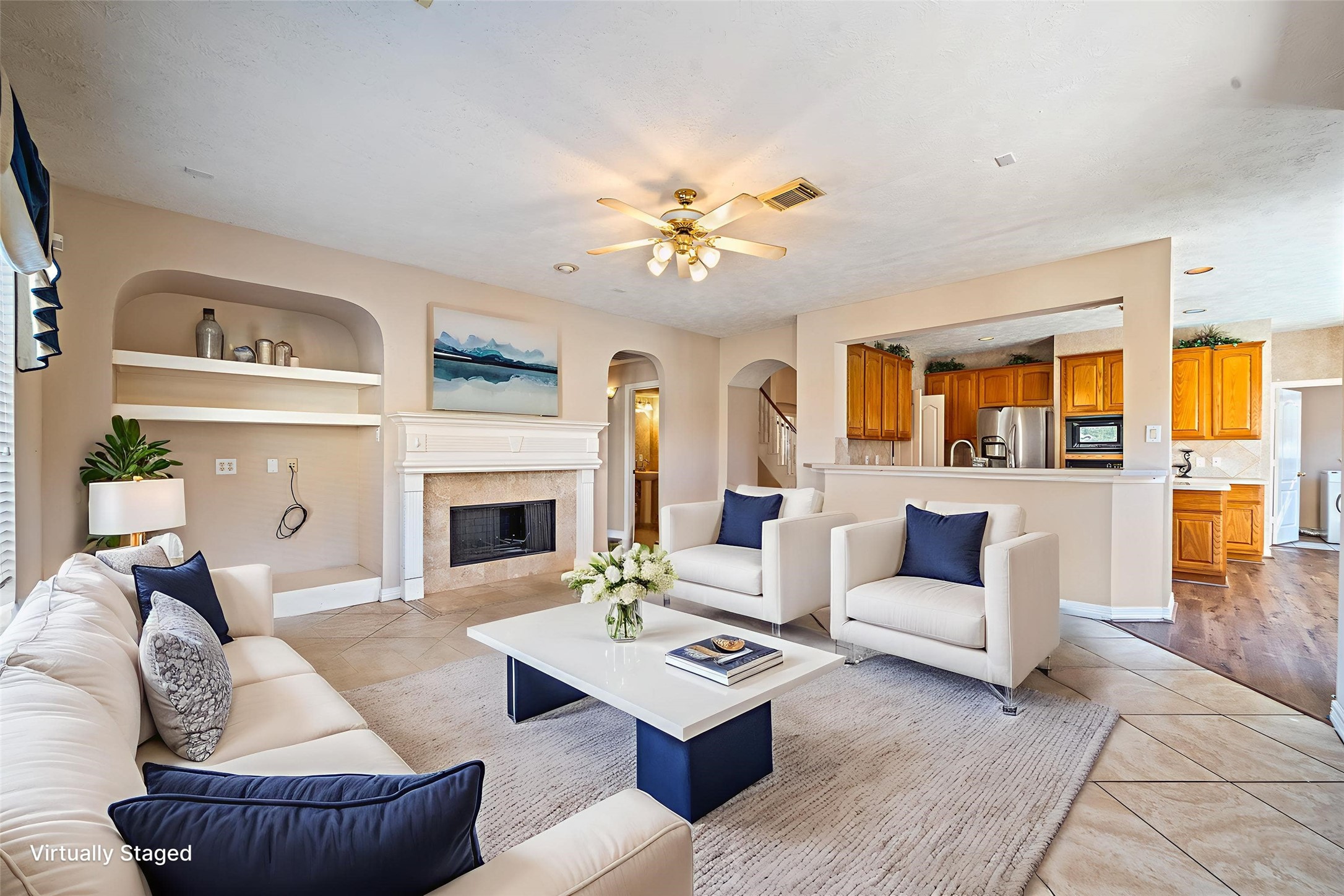 9306 Lochflora Drive Spring, TX 77379 - Photo 9 of 48 a living room with furniture a fireplace and a large window