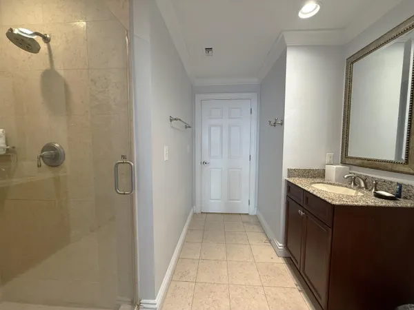 a bathroom with a double vanity sink and mirror