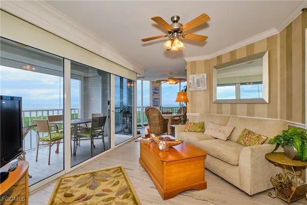 a living room with furniture fireplace and a flat screen tv
