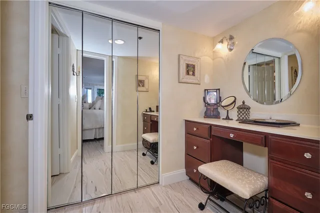 a spacious bathroom with a double vanity sink and a mirror