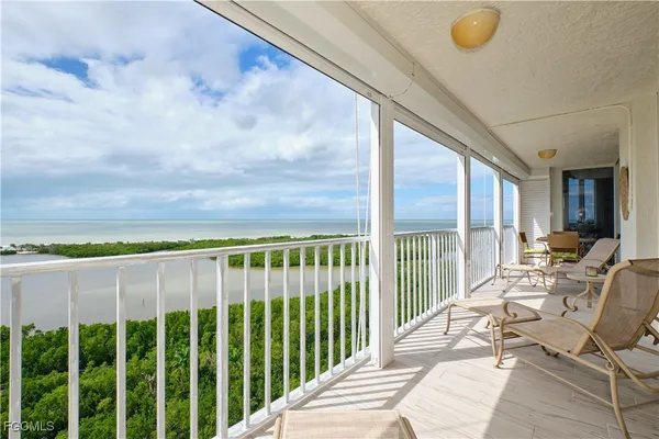 a balcony with chairs