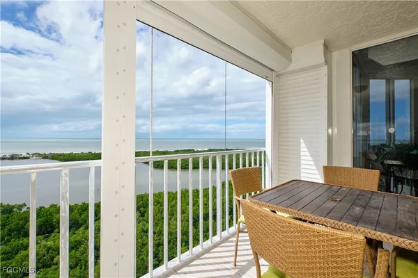 a view of a balcony with wooden floor