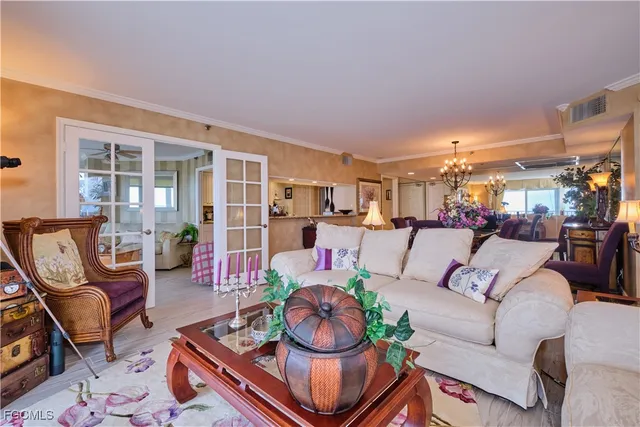 a living room with furniture fireplace and wooden floor