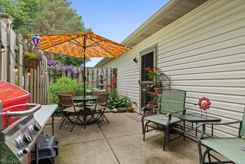 808 Ryan Road, Unit 14 Medina, OH 44256 - Photo 31 of 40 Paved patio area featuring privacy fencing and mature plantings