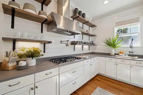 a bedroom with a bed and a ceiling fan