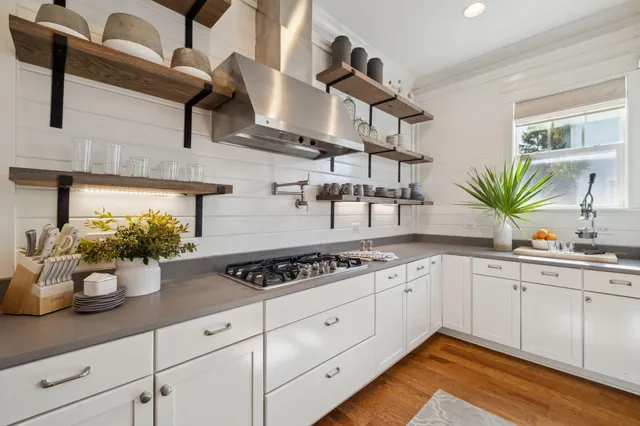 a bedroom with a bed and a ceiling fan