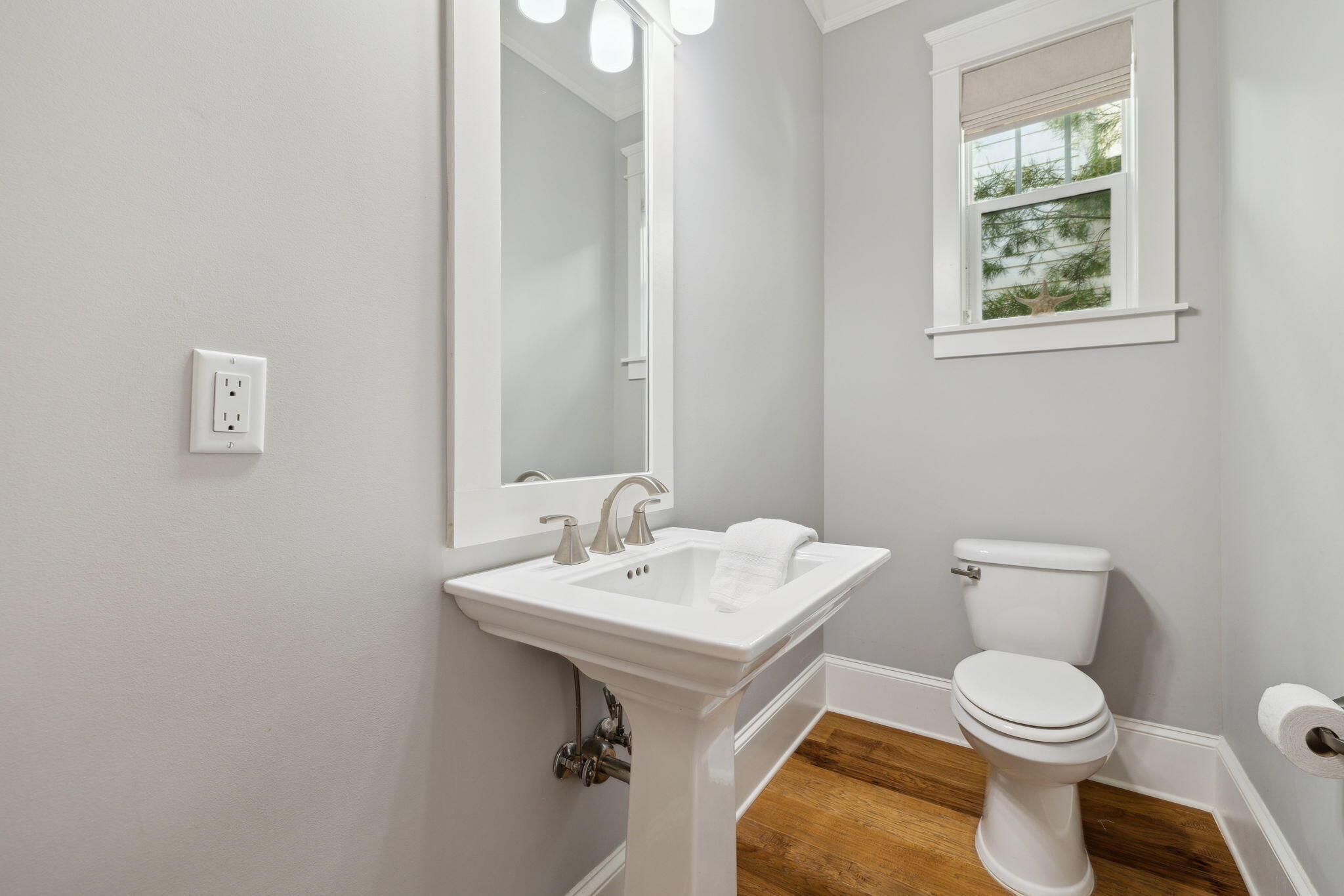 89 Clipper Street Inlet Beach, FL 32461 - Photo 32 of 72 a white toilet sitting next to a bathroom sink