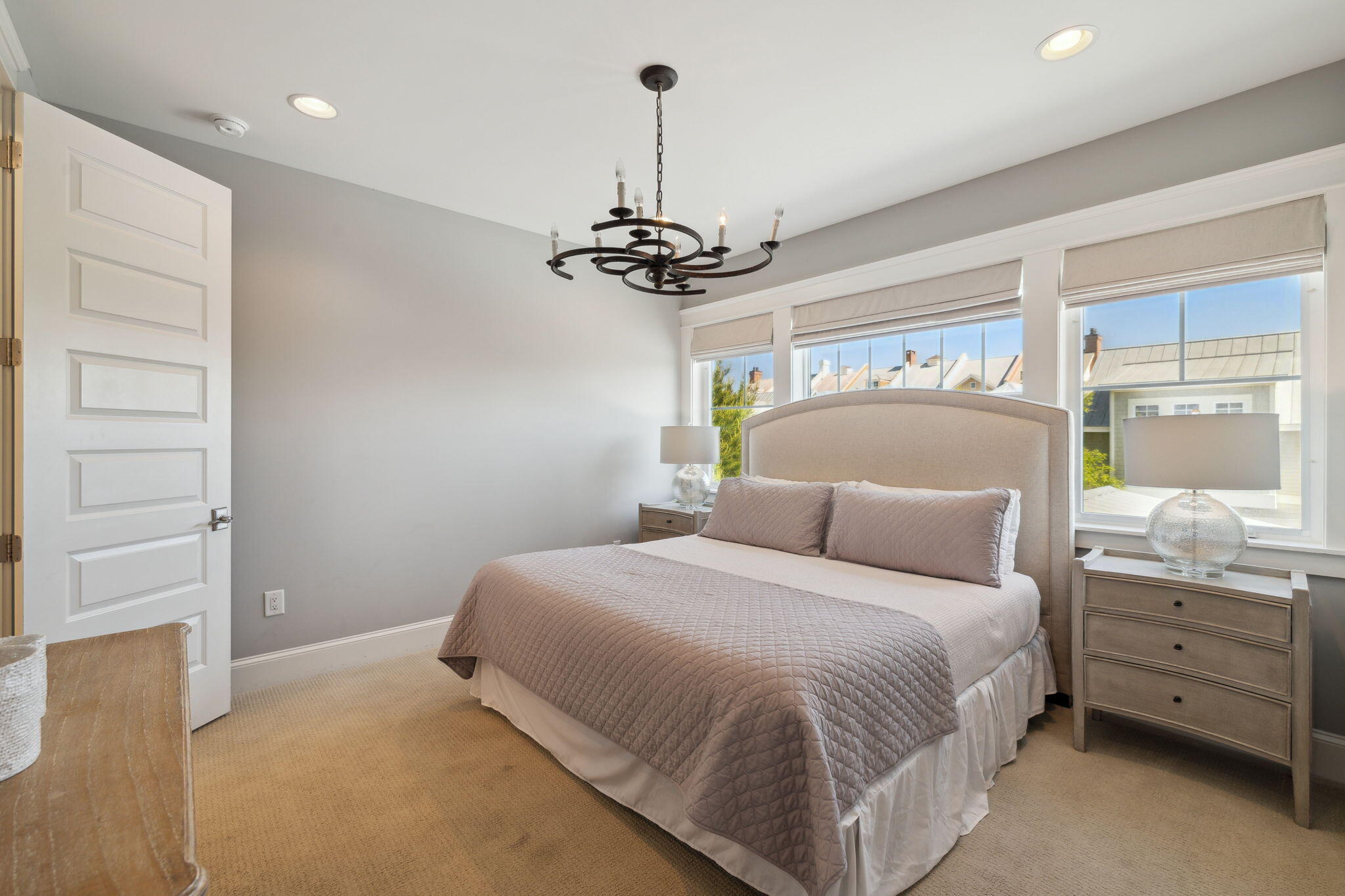 89 Clipper Street Inlet Beach, FL 32461 - Photo 43 of 72 a bedroom with a bed and a chandelier