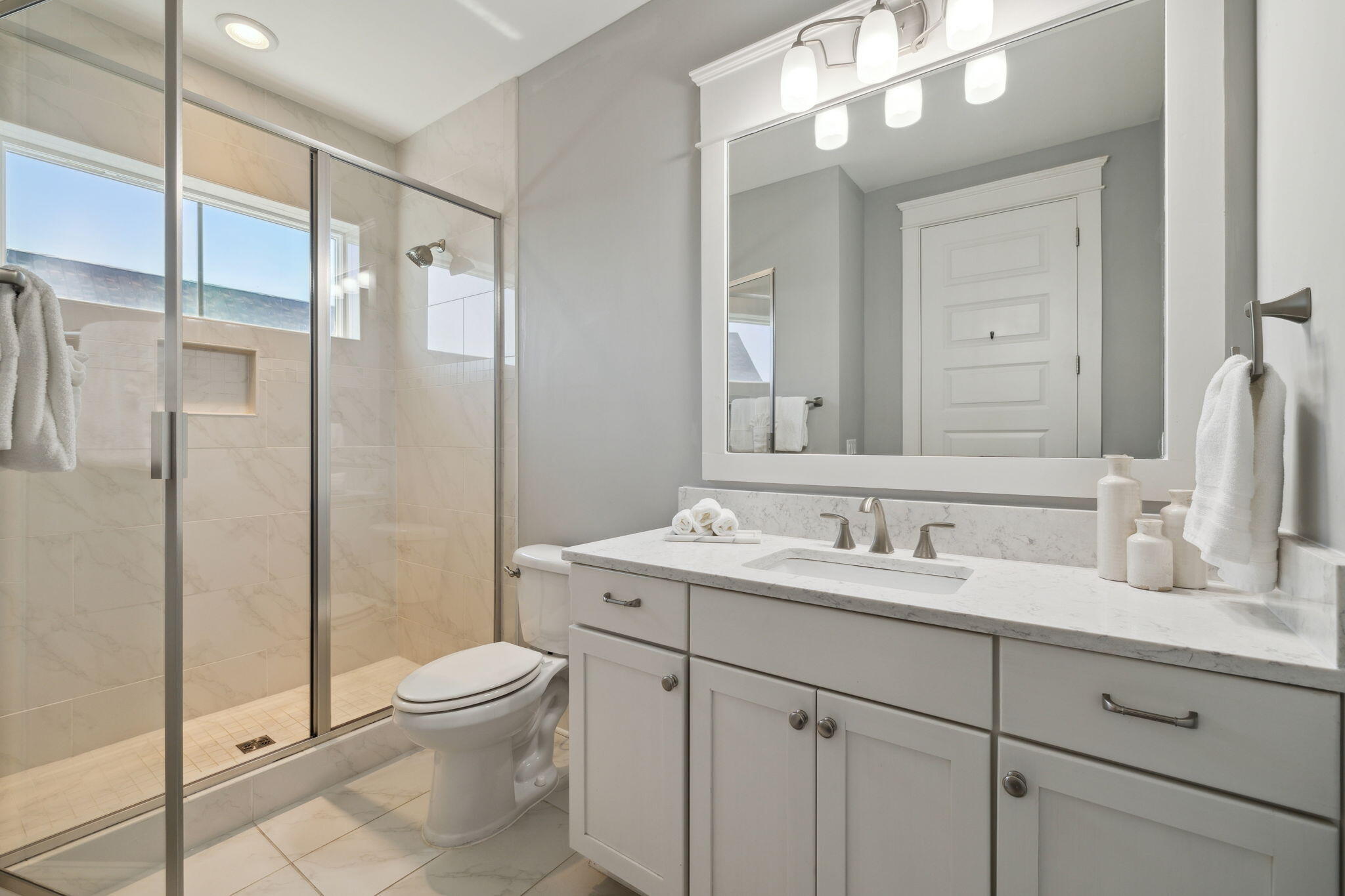 89 Clipper Street Inlet Beach, FL 32461 - Photo 45 of 72 a bathroom with a toilet a sink a mirror and a shower