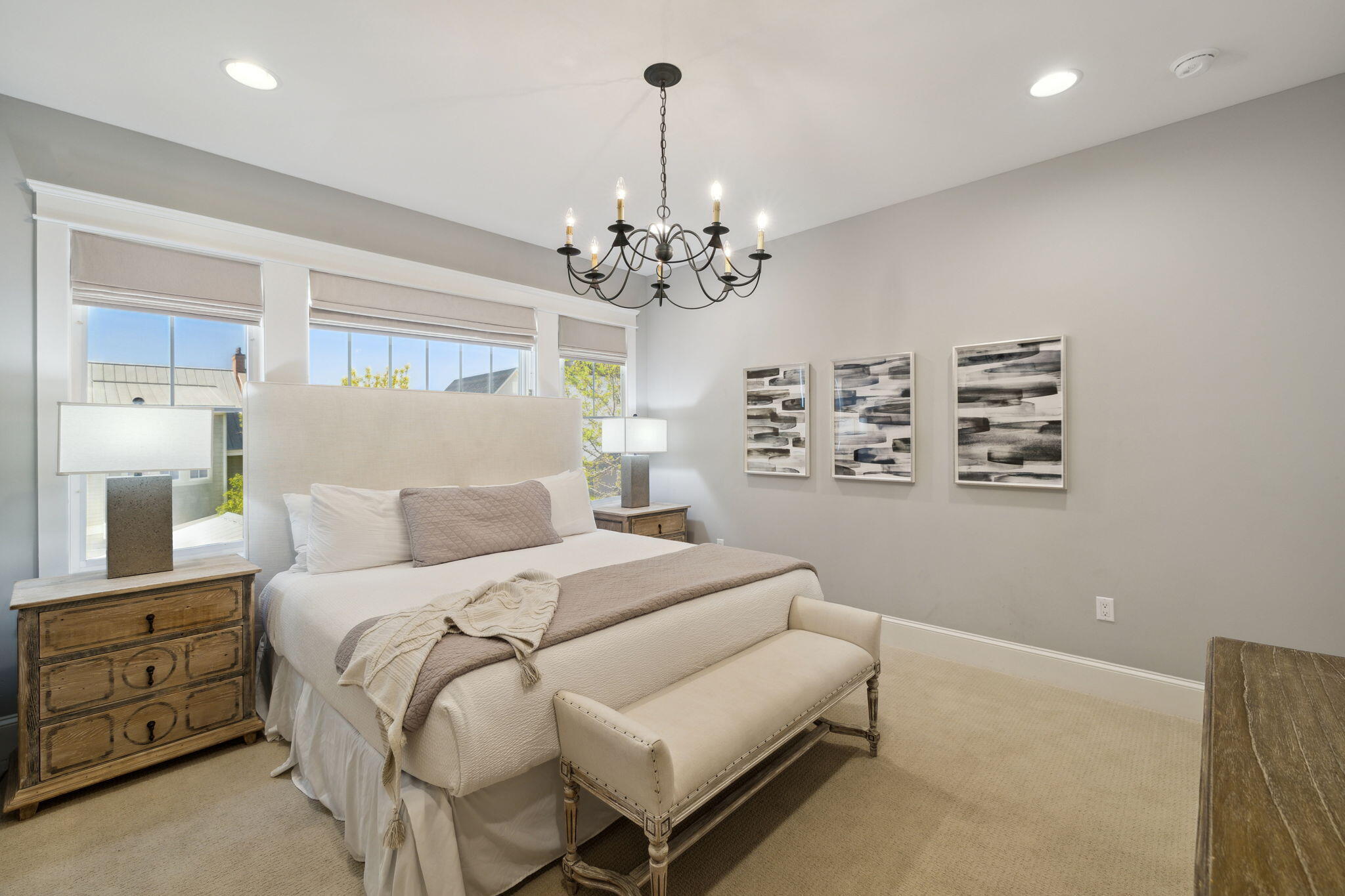 89 Clipper Street Inlet Beach, FL 32461 - Photo 47 of 72 a bedroom with a large bed and a chandelier