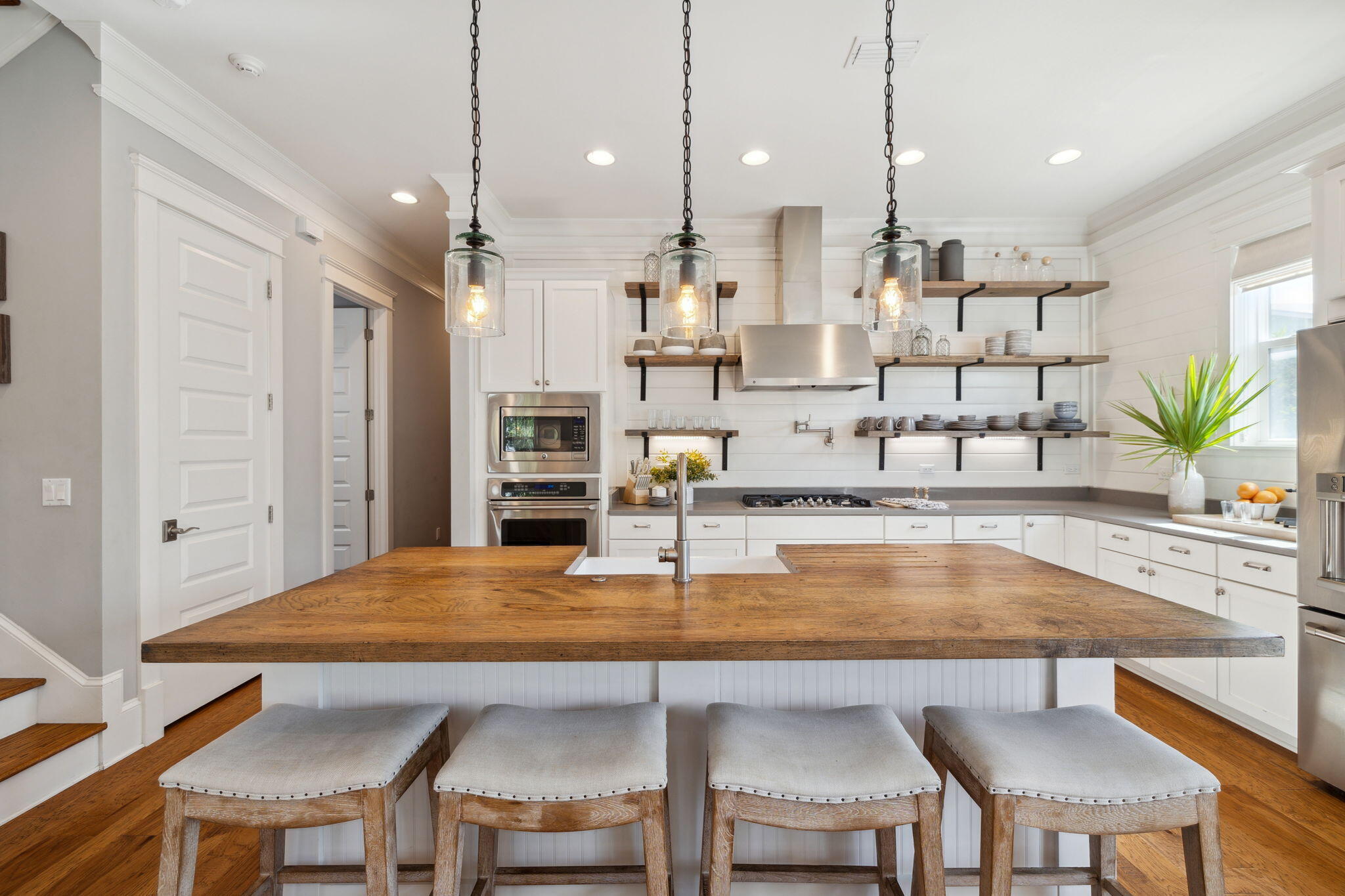 89 Clipper Street Inlet Beach, FL 32461 - Photo 5 of 72 a kitchen with kitchen island a table and chairs in it