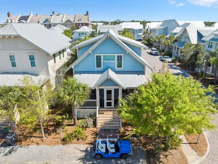 a view of a patio with table and chairs potted plants