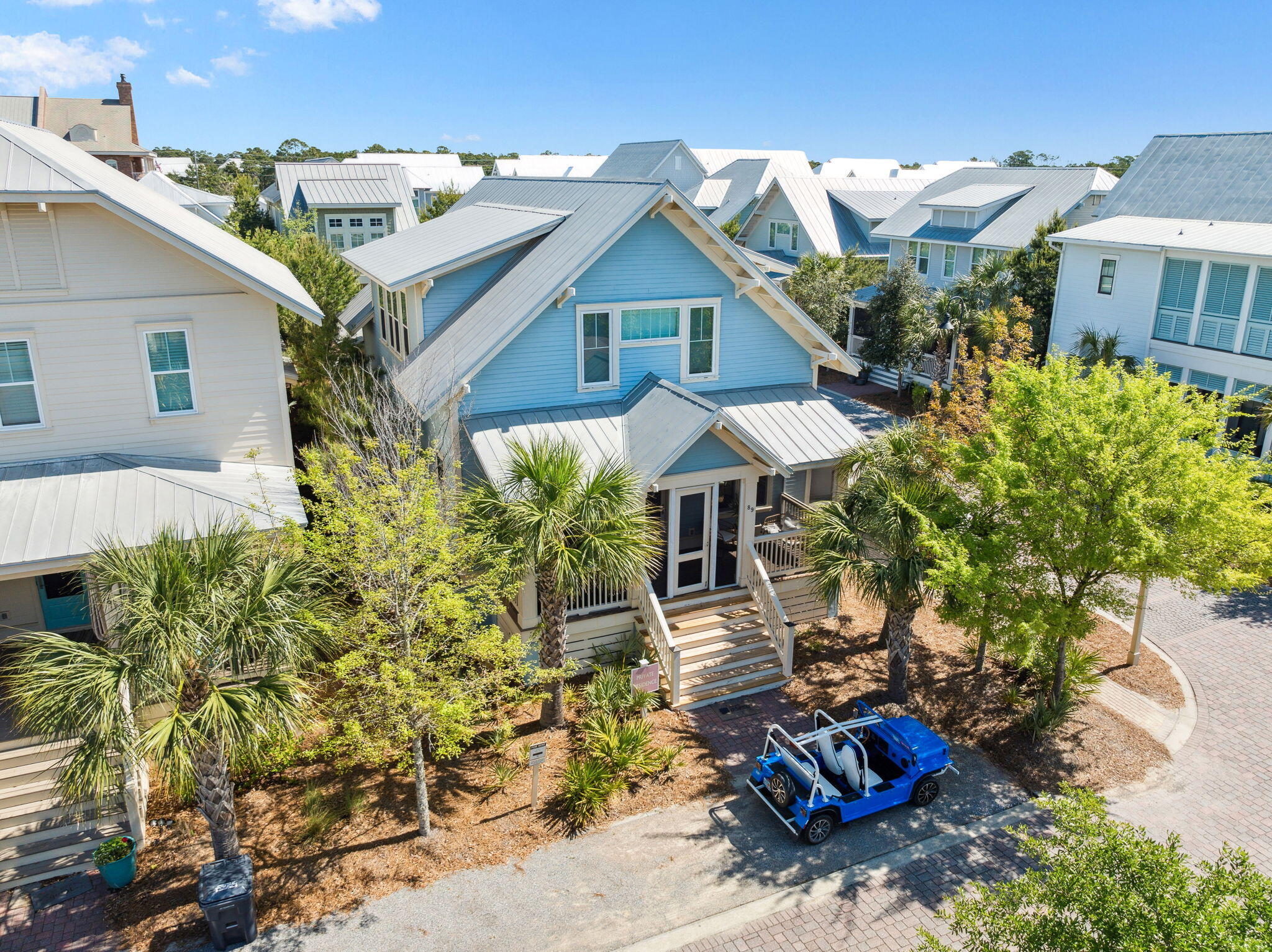 89 Clipper Street Inlet Beach, FL 32461 - Photo 10 of 72 a view of a patio with table and chairs potted plants