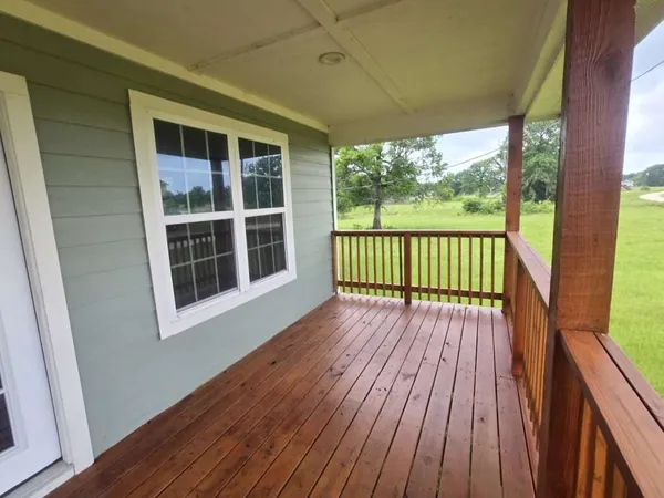 a view of porch with wooden floor and outdoor space