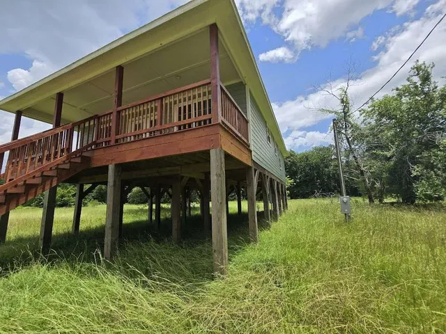a backyard of a house with lots of green space