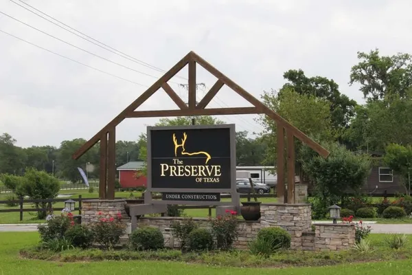 a view of outdoor space with signage and flags