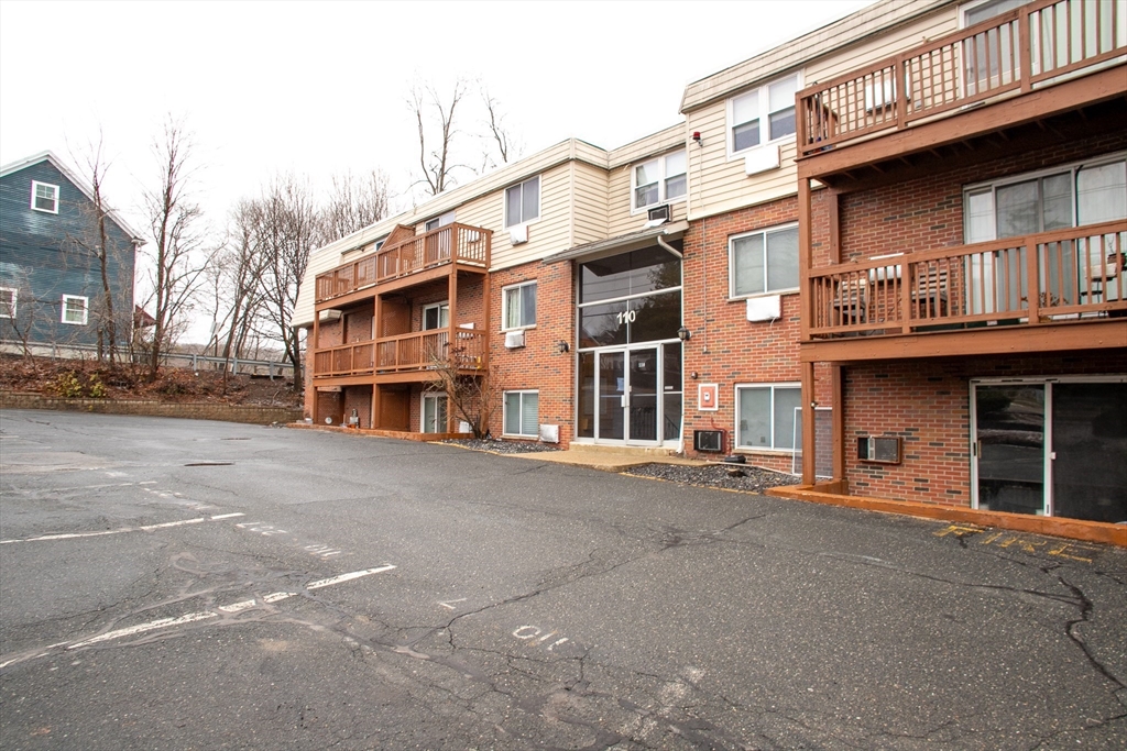 a view of a building with a street