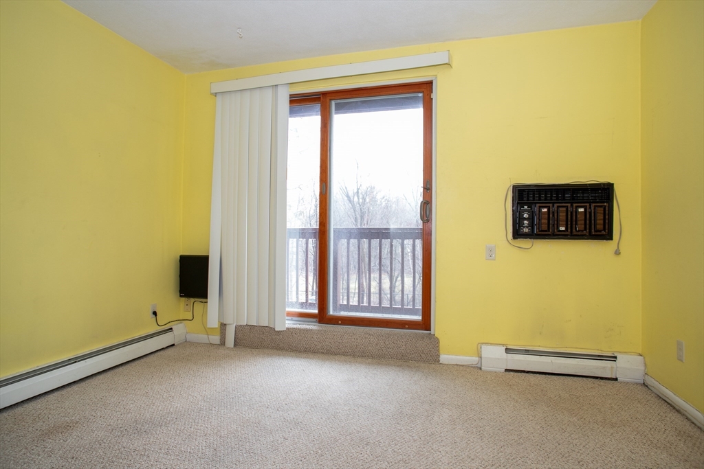 110 Boston Post Road East, Unit 104 Marlborough, MA 01752 - Photo 15 of 28 an empty room with windows