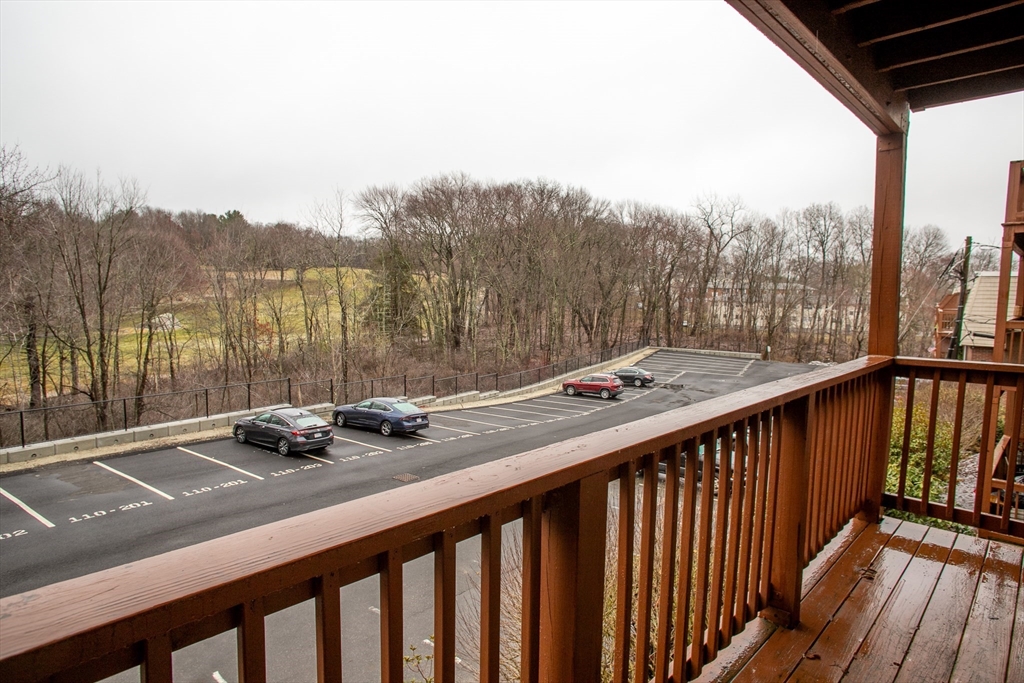 110 Boston Post Road East, Unit 104 Marlborough, MA 01752 - Photo 16 of 28 a view of a two chairs and table in the balcony