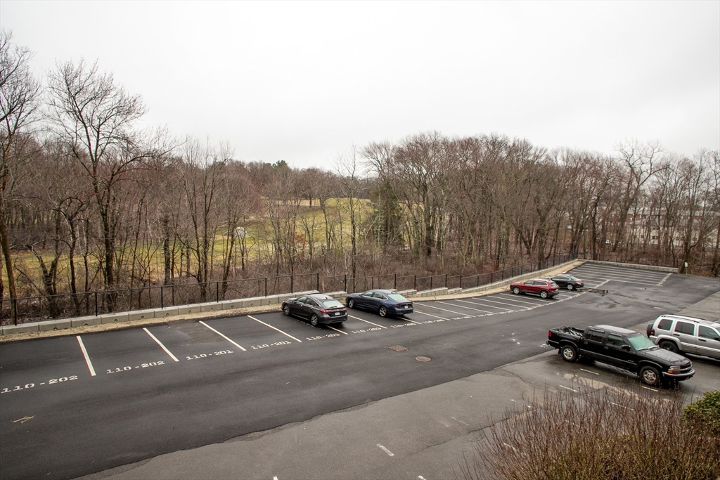 110 Boston Post Road East, Unit 104 Marlborough, MA 01752 - Photo 17 of 28 a view of a street with a car parked on the road