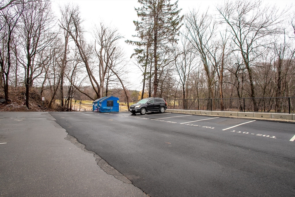 110 Boston Post Road East, Unit 104 Marlborough, MA 01752 - Photo 18 of 28 a car parked on the side of the road