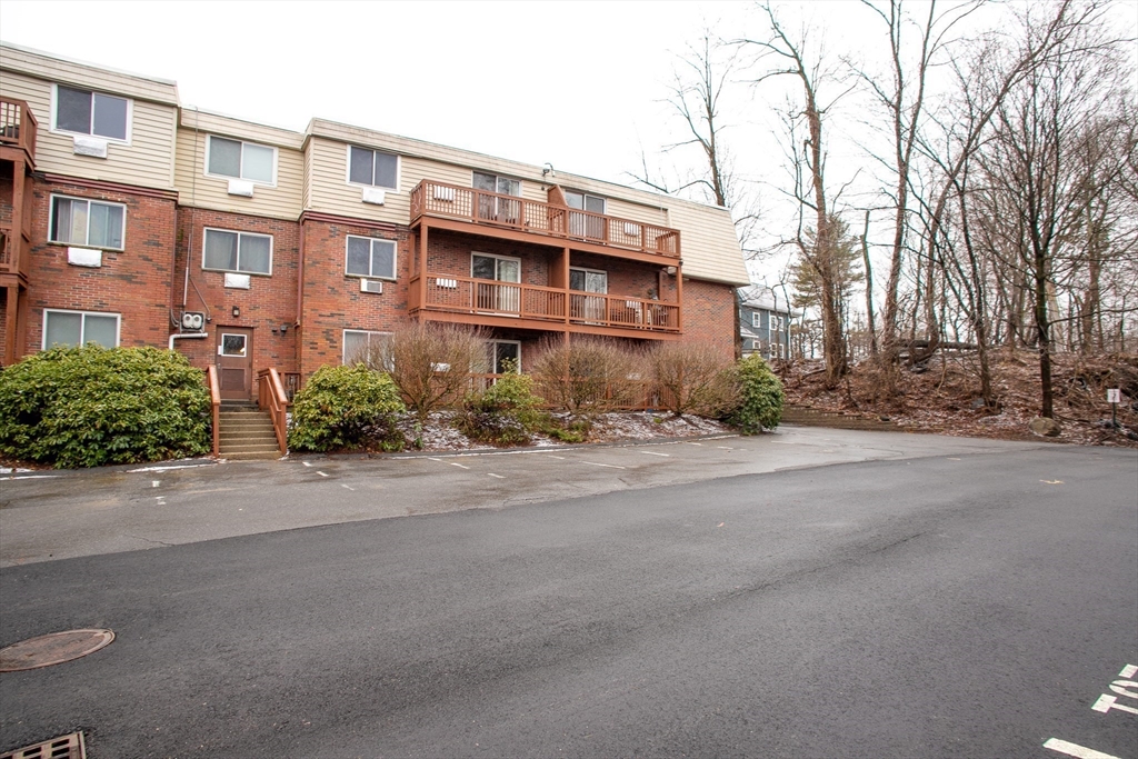 110 Boston Post Road East, Unit 104 Marlborough, MA 01752 - Photo 19 of 28 front view of a building with a street